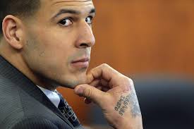 Aaron Hernandez has been charged with trying to silence a witness in a double murder case against him