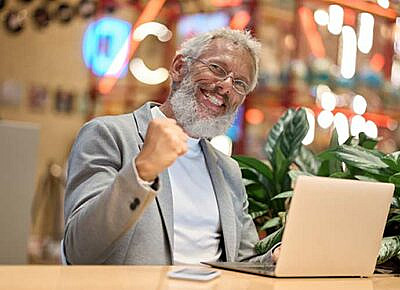 happy businesman using laptop