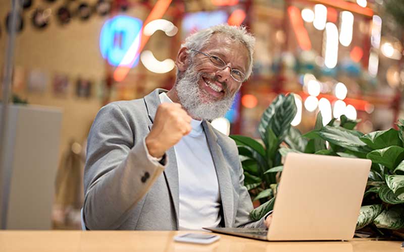 happy businesman using laptop